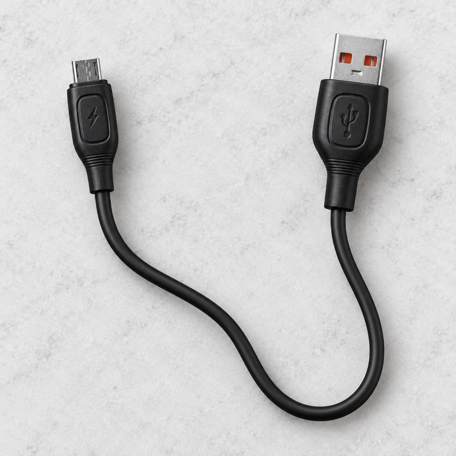 Cable negro Mixor Inspira USB a micro USB V8 sobre una superficie clara, con ambos conectores a la vista (imagen ilustrativa) — miniatura 5