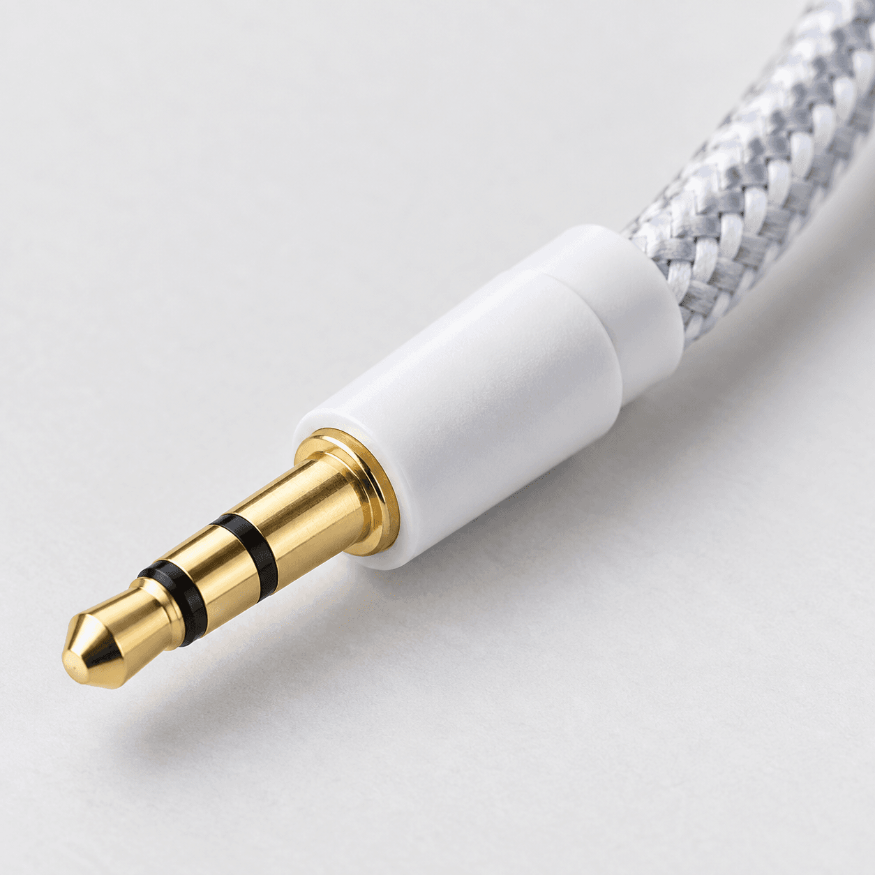 WEB-CABLES-DVR-2026-09-28|CABAUXTELA1M|03|d8a1472fab7b6b2b|Cable Auxiliar 3.5 mm Macho a Macho Mallado 1 m Blanco - imagen 3